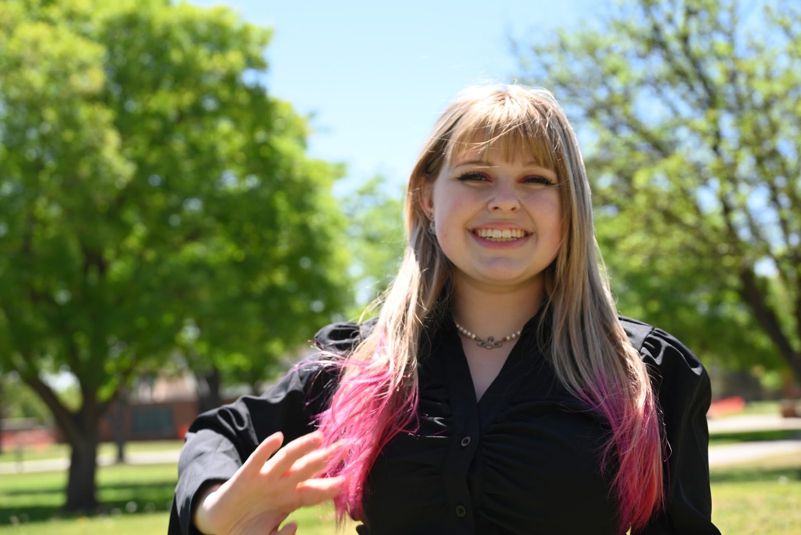 Haley Tarrant smiling outdoors on a sunny day